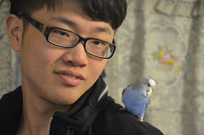 Close-up of young man with eyeglasses