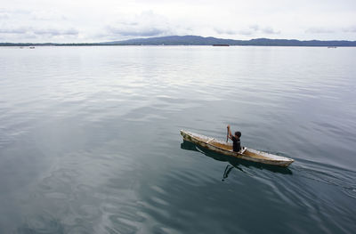 Man in boat on lake