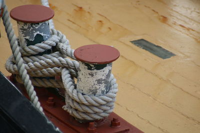 Close-up of rope tied to bollard