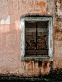 Low angle view of window on old building