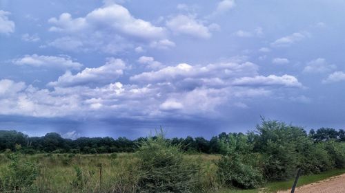 Scenic view of landscape against cloudy sky