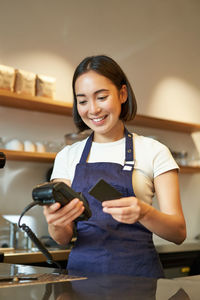 Young woman using mobile phone