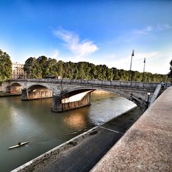 Bridge over river against sky