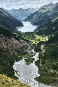 Scenic view of river amidst mountains