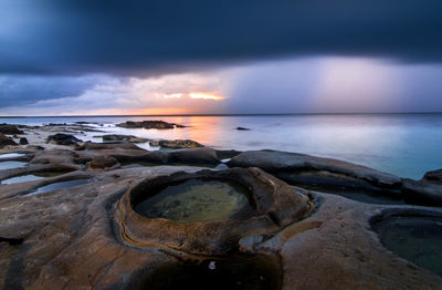 Scenic view of sea against sky during sunset