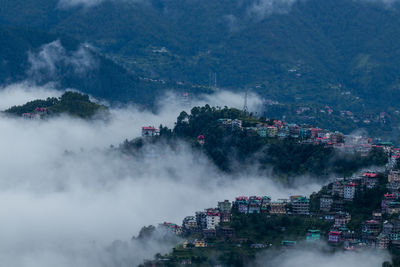 High angle view of trees and mountains against sky