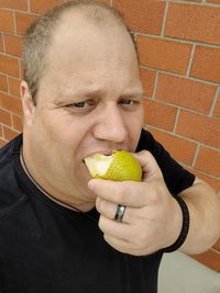 Portrait of man eating food