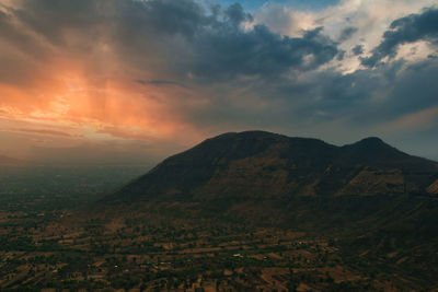 Scenic view of mountains against sky during sunset