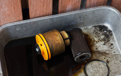 High angle view of old machine in container