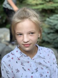 Close-up of blond girl looking away