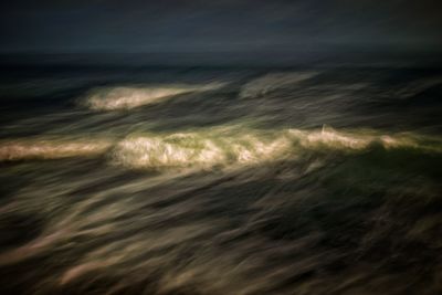 Aerial view of agricultural field against sky