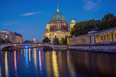 Illuminated buildings in water