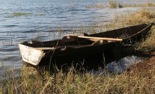 Abandoned boat in water