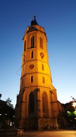 Low angle view of clock tower against sky