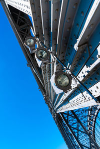 Low angle view of clock tower against blue sky