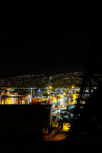High angle view of illuminated buildings in city at night