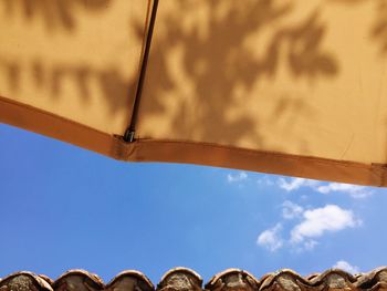 Low angle view of built structure against blue sky
