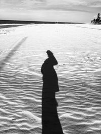 Shadow of man on beach