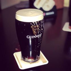 Close-up of beer glass on table