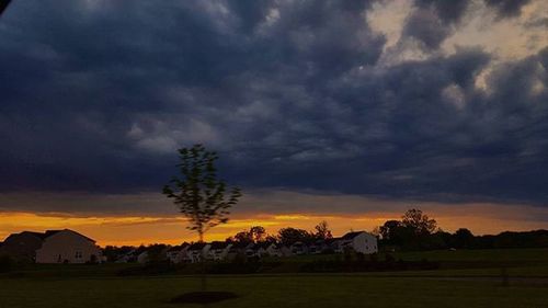 Scenic view of landscape against cloudy sky