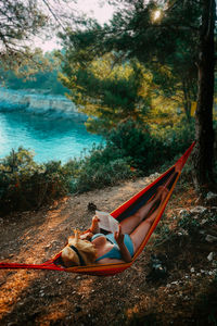 Woman lying down on shore