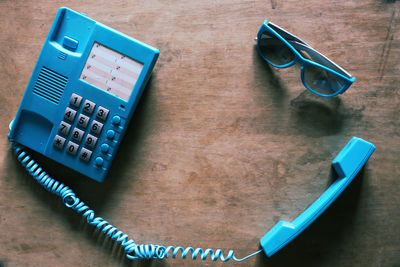 High angle view of mobile phone on table
