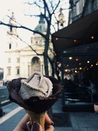 Close-up of hand holding ice cream cone