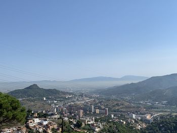 Aerial view of townscape against sky