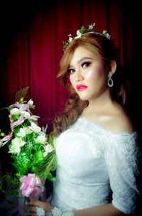 Portrait of beautiful young woman at home