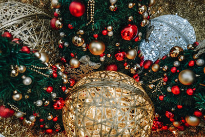 Golden red christmas decorations and spruce branches. festive mood. beautiful bokeh. new year