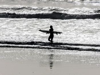 Full length of man standing in sea