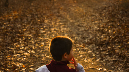 Portrait of boy standing outdoors