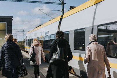 Women on train station platform