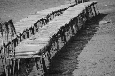 Wooden posts on beach