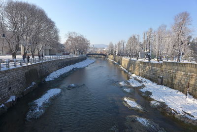 Scenic view of frozen lake against sky during winter