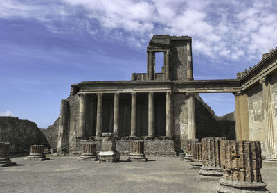 Old ruin building against cloudy sky in pompeii