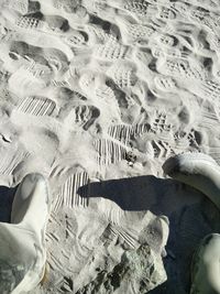 Low section of person on sand