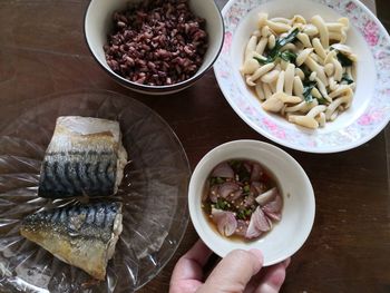 High angle view of person preparing food on table