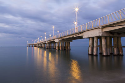 Bridge over sea against sky