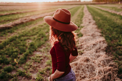 Full length of woman standing on field