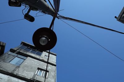 Low angle view of communications tower against clear sky