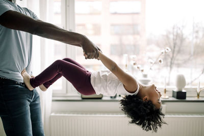 Low section of man exercising at home