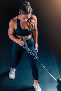 Low section of woman exercising in gym
