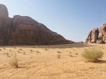 Scenic view of desert against clear sky