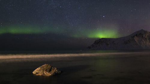 Scenic view of sea against sky at night