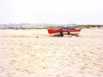 Lifeguard chair on beach against clear sky