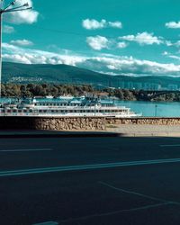 Scenic view of sea by city against sky