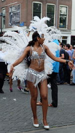 Full length of woman standing by railing