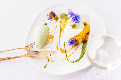 High angle view of food in plate on white background