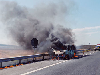 Train on road against sky